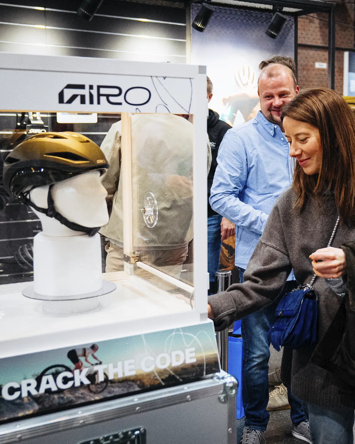 Visitors gathering around the Giro Crack the Code booth and safe activation